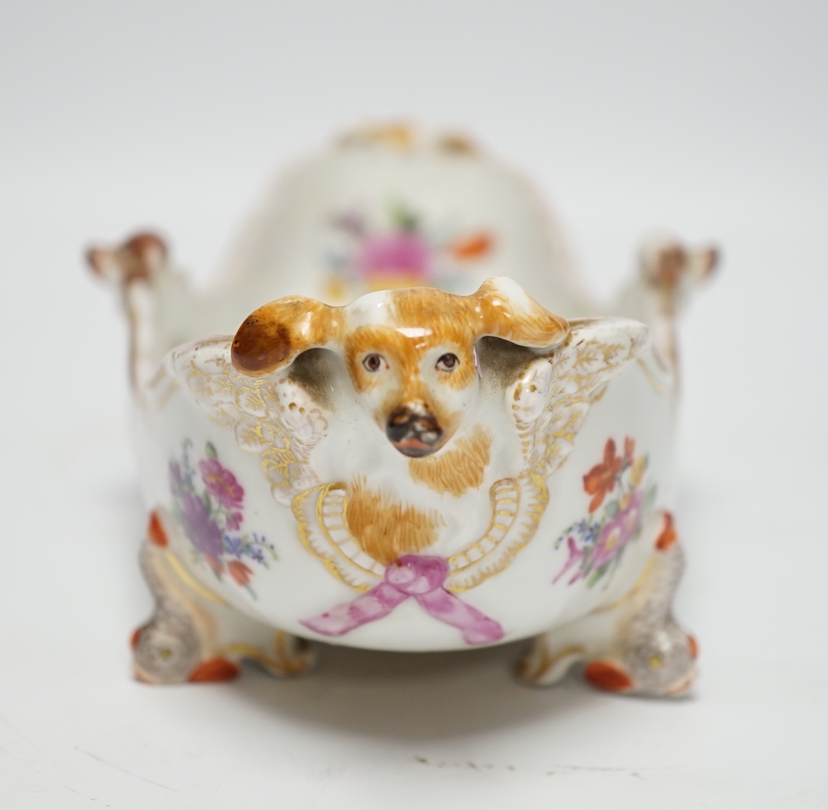 A Dresden Helena Wolfsohn boat-shaped dish, with dog head ornamentation, 34cm wide